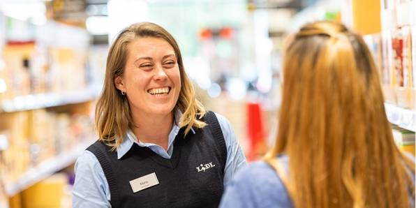 Store Manager laughing instore